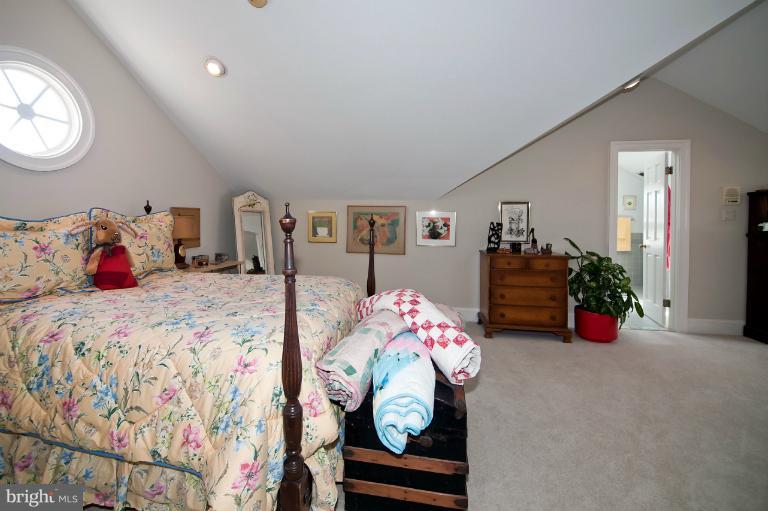 1626 Foxhall Road Northwest Washington, DC 20007 - Photo 13 of 21 a bedroom with bed and a chandelier