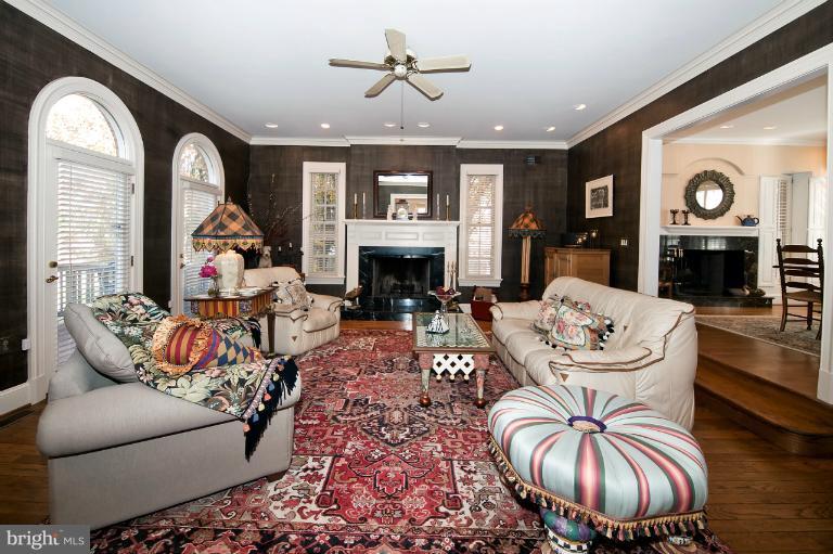 1626 Foxhall Road Northwest Washington, DC 20007 - Photo 14 of 21 a living room with furniture a fireplace and a large window