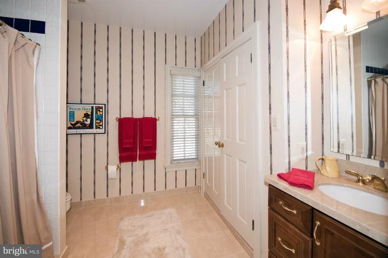 1626 Foxhall Road Northwest Washington, DC 20007 - Photo 3 of 21 a kitchen with a sink and a refrigerator