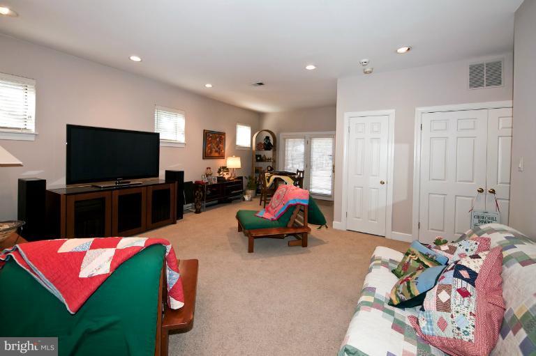 1626 Foxhall Road Northwest Washington, DC 20007 - Photo 6 of 21 a living room with furniture and a flat screen tv