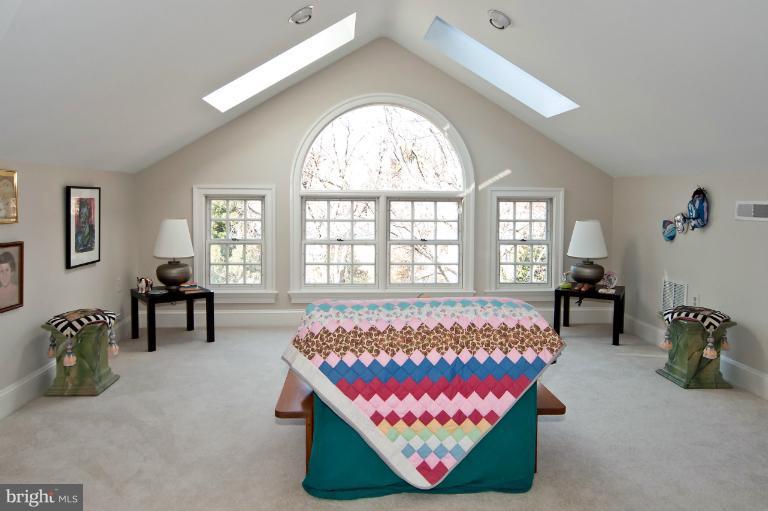 1626 Foxhall Road Northwest Washington, DC 20007 - Photo 9 of 21 a bed room with a bed and a couch