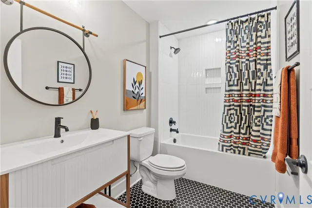 a bathroom with a toilet sink and a mirror