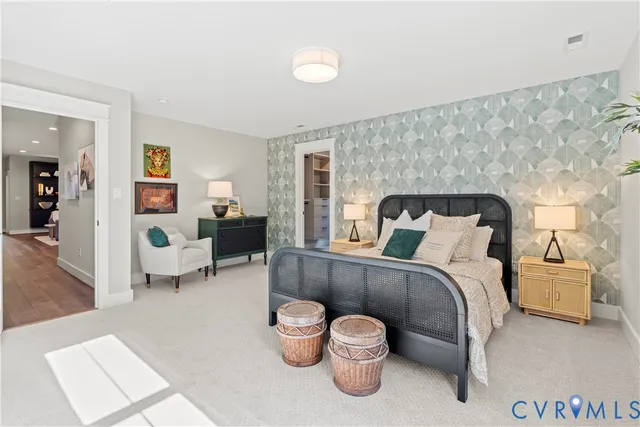 a bedroom with a bed and a couch