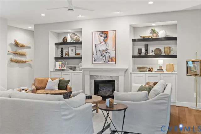 a living room with furniture and a fireplace