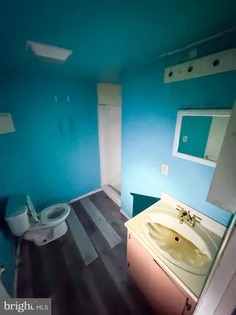 a bedroom with a bed and a wall