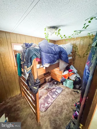 a bedroom with a bed and a mirror
