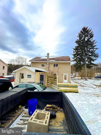a view of a backyard of the house