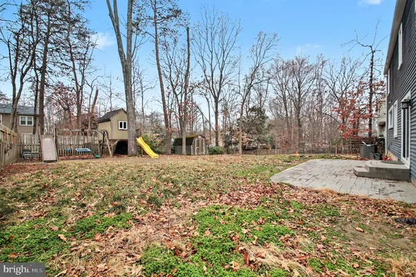 a view of a yard with snow on the road