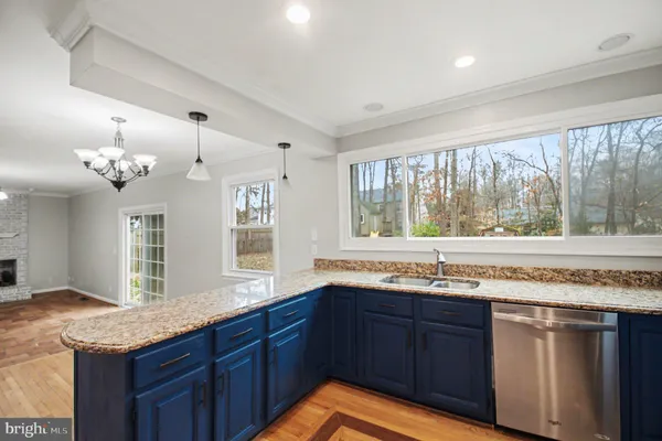 a kitchen with a sink and a large window