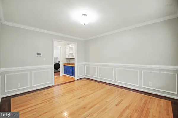 a view of a kitchen with wooden floor and a sink