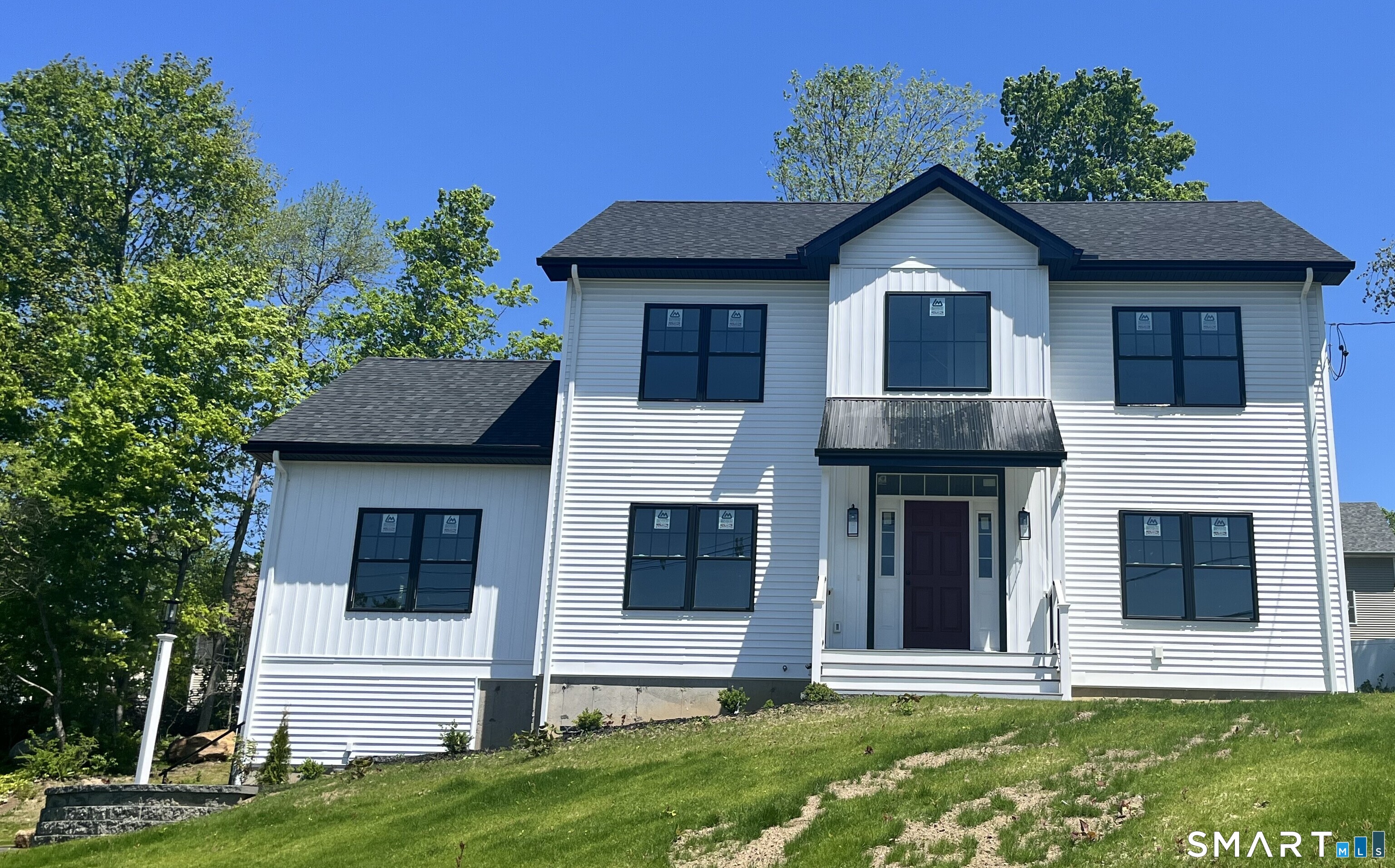 a front view of a house with a yard