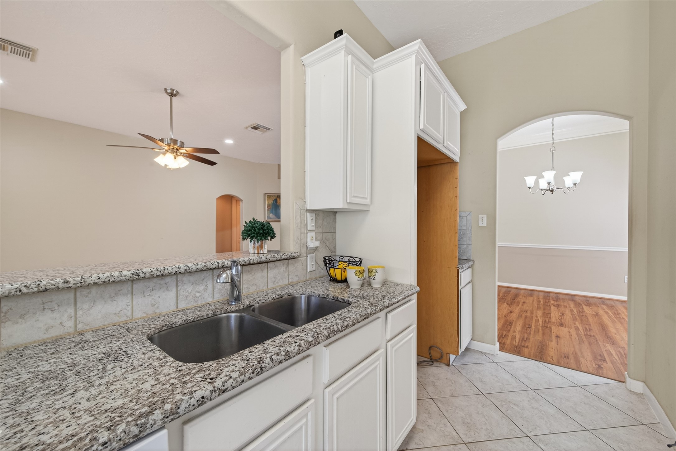 23211 Goldensong Court Spring, TX 77373 - Photo 21 of 46 a kitchen with a sink cabinets and window