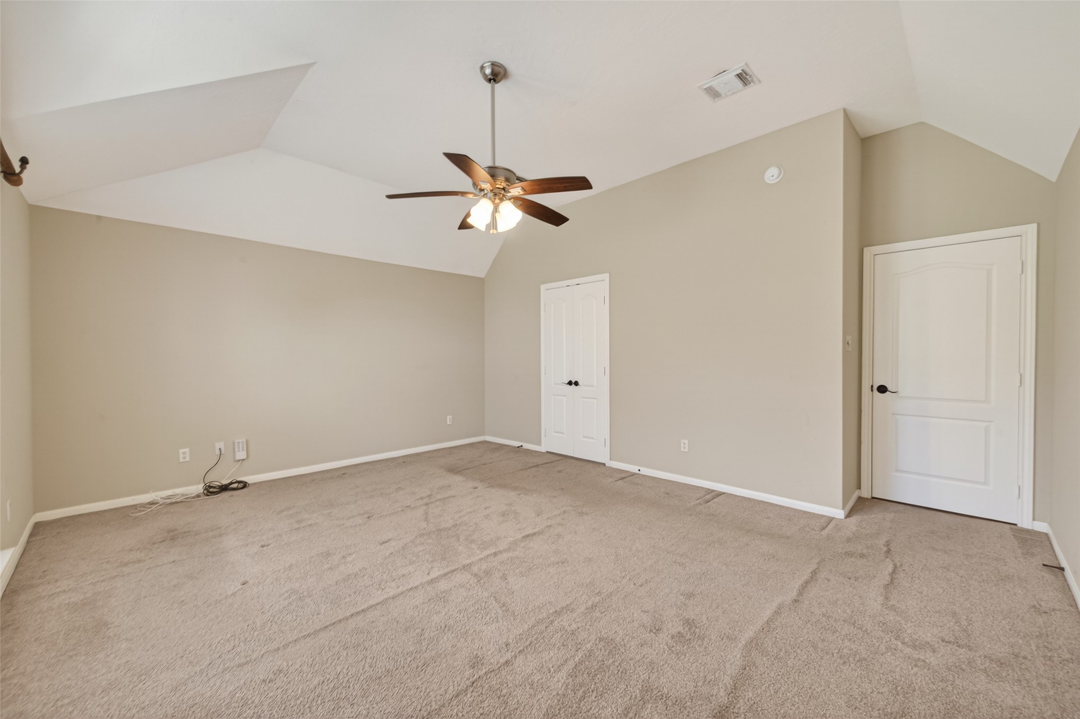 23211 Goldensong Court Spring, TX 77373 - Photo 27 of 46 an empty room with a ceiling fan and a window