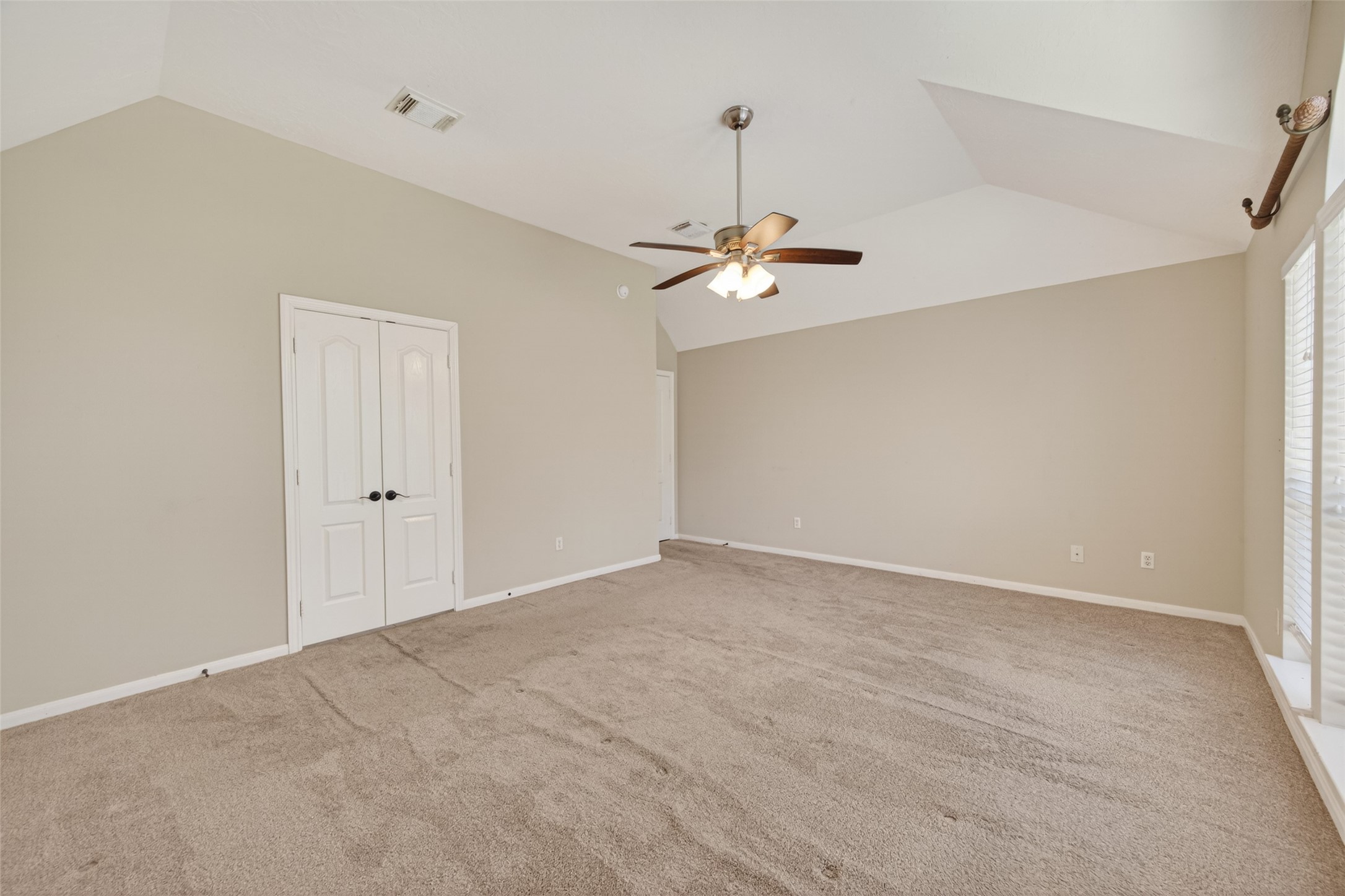 23211 Goldensong Court Spring, TX 77373 - Photo 28 of 46 a view of an empty room with a chandelier fan