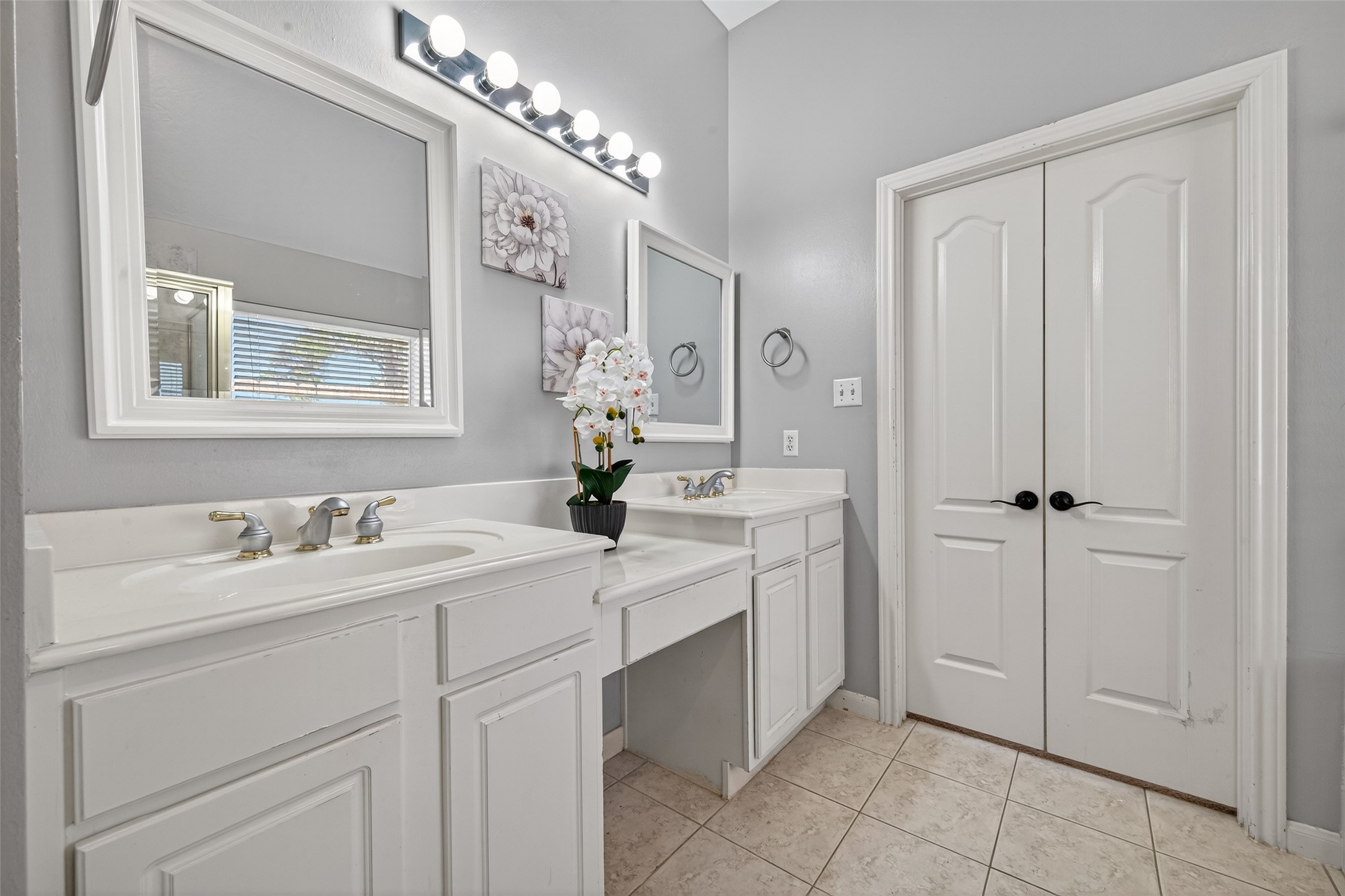 23211 Goldensong Court Spring, TX 77373 - Photo 30 of 46 a spacious bathroom with a double vanity sink a mirror and shower