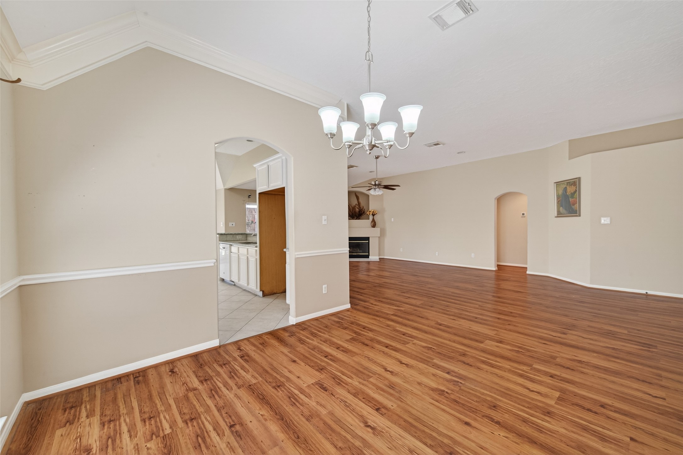 23211 Goldensong Court Spring, TX 77373 - Photo 5 of 46 a view of empty room with wooden floor and kitchen view
