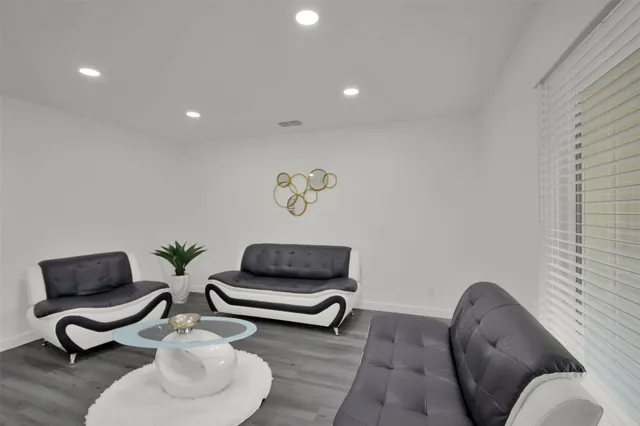 a living room with furniture and a chair