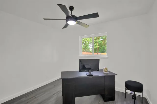 a workspace with furniture and window