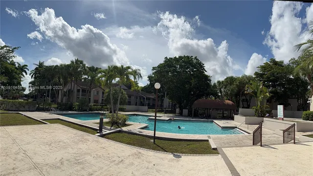 a view of a park with swings and slides