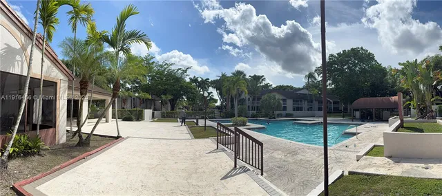 a view of a backyard with sitting area