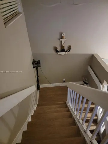 a view of hallway with stairs