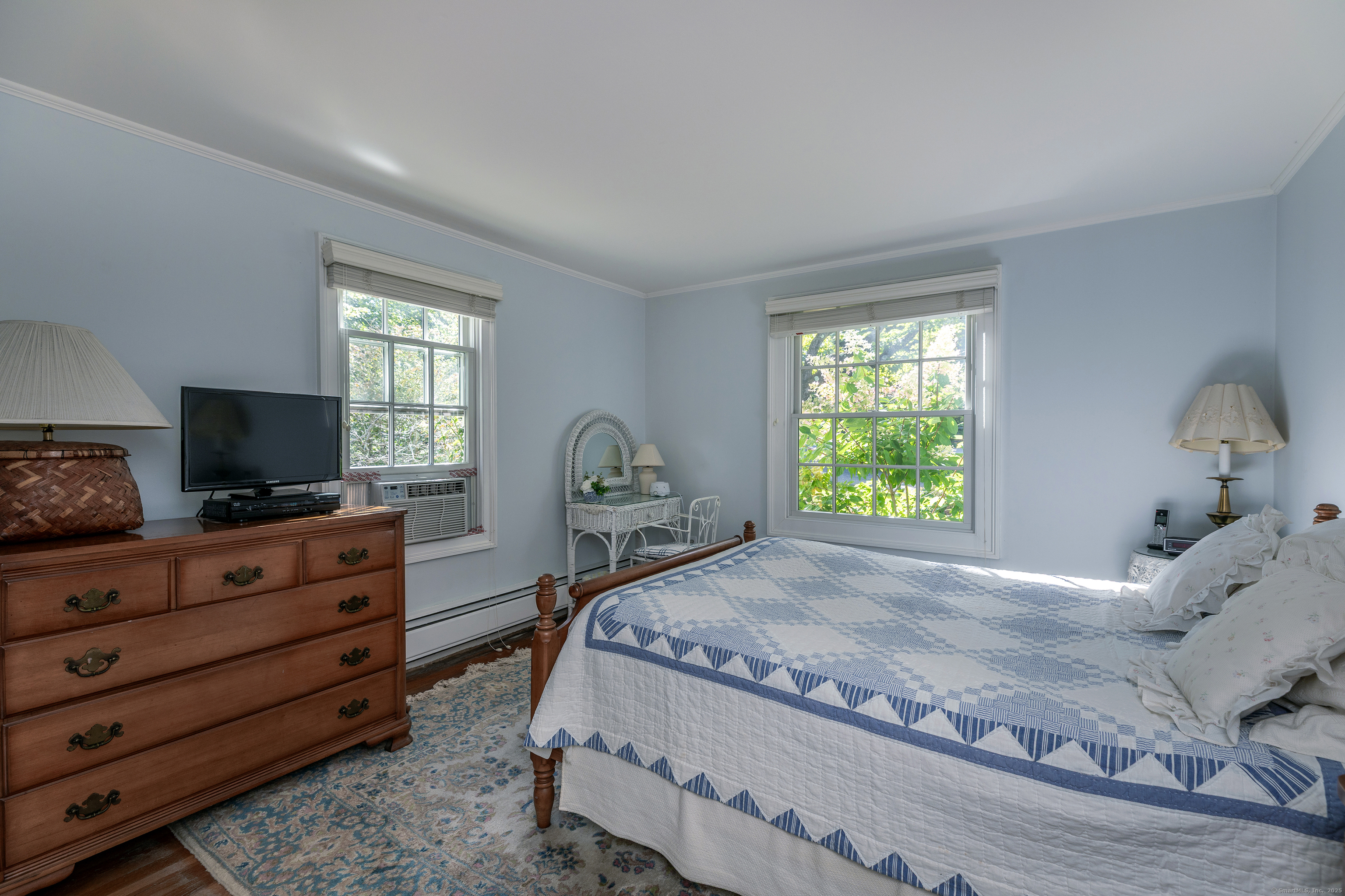 109 Church Hill Road Washington, CT 06794 - Photo 19 of 30 a bedroom with a bed and a flat screen tv