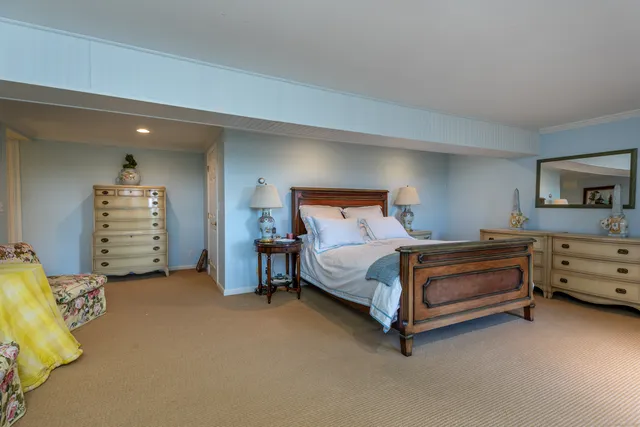 a bedroom with bed and window