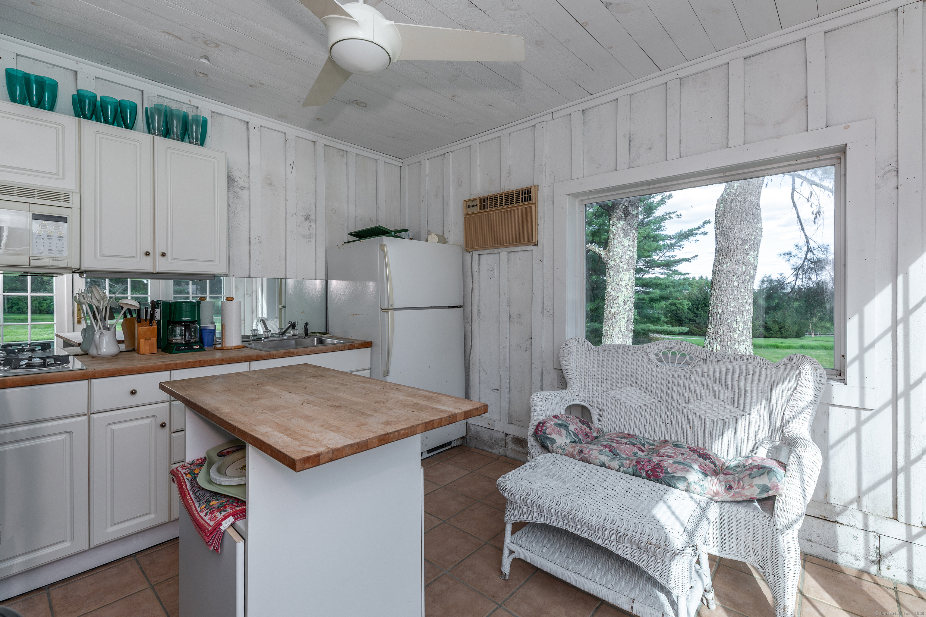 109 Church Hill Road Washington, CT 06794 - Photo 28 of 30 a kitchen with stainless steel appliances granite countertop a sink stove and refrigerator