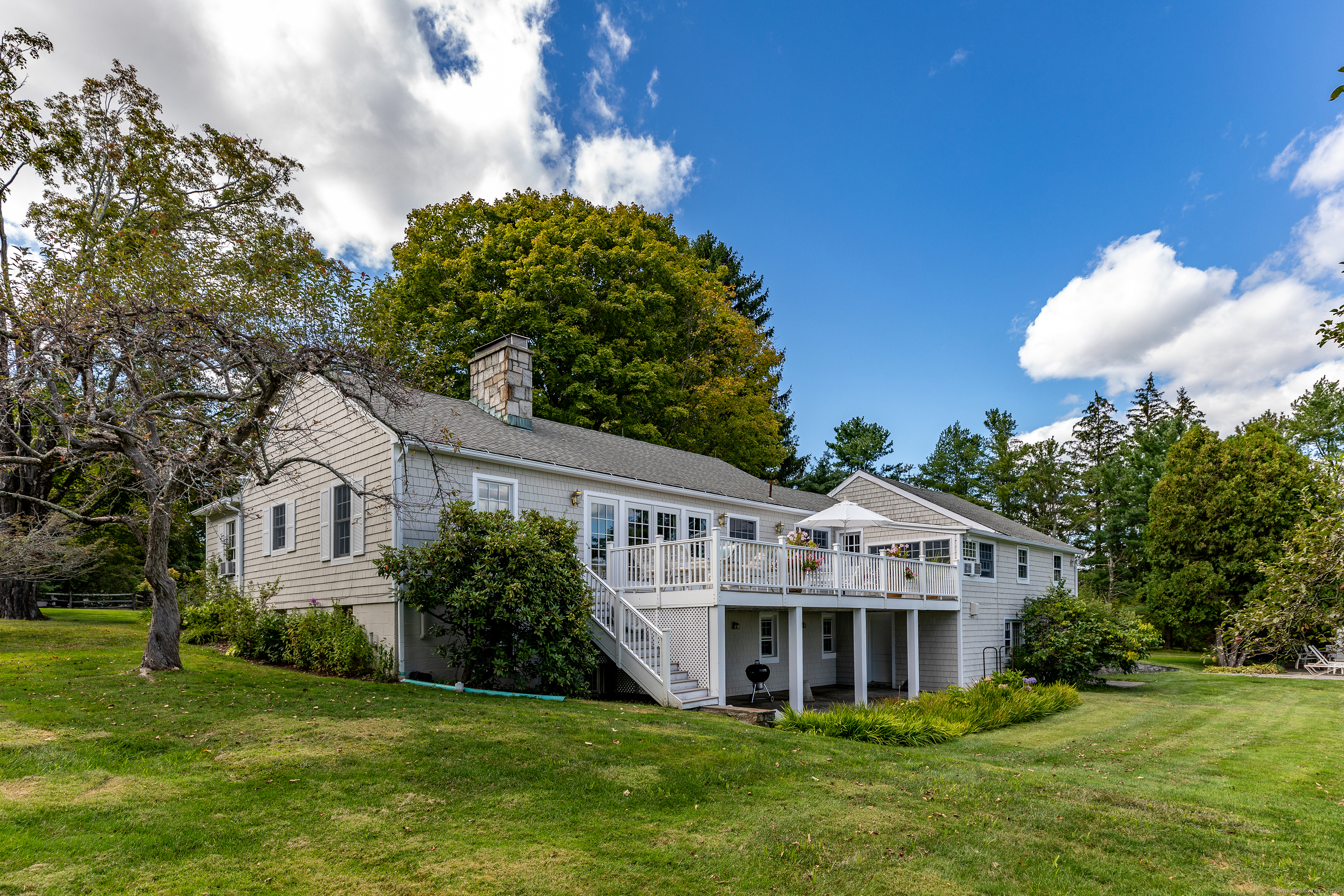 109 Church Hill Road Washington, CT 06794 - Photo 6 of 30 a view of a house with a big yard and potted plants