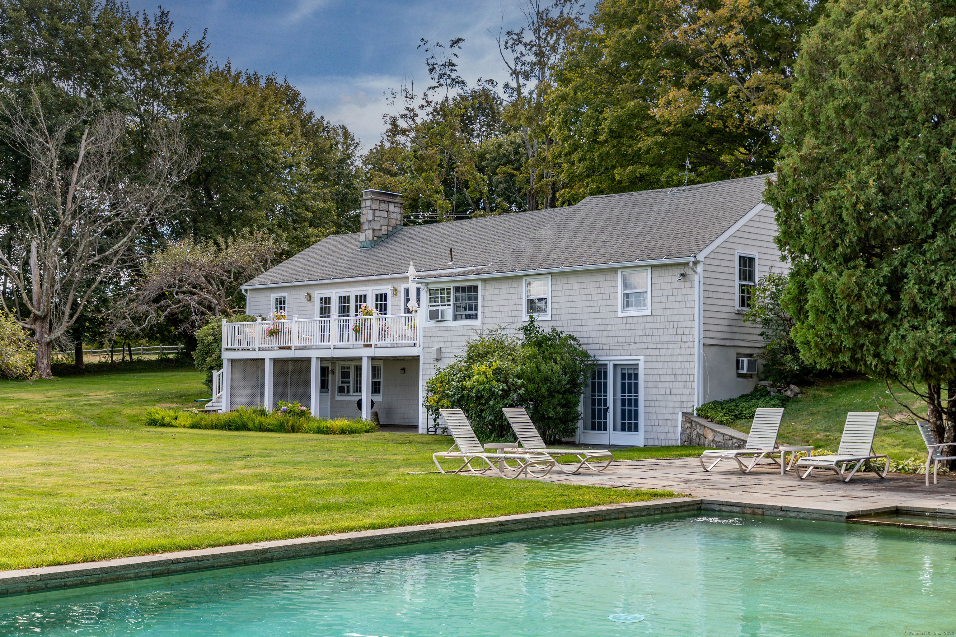 109 Church Hill Road Washington, CT 06794 - Photo 7 of 30 a view of house that has a swimming pool next to a yard