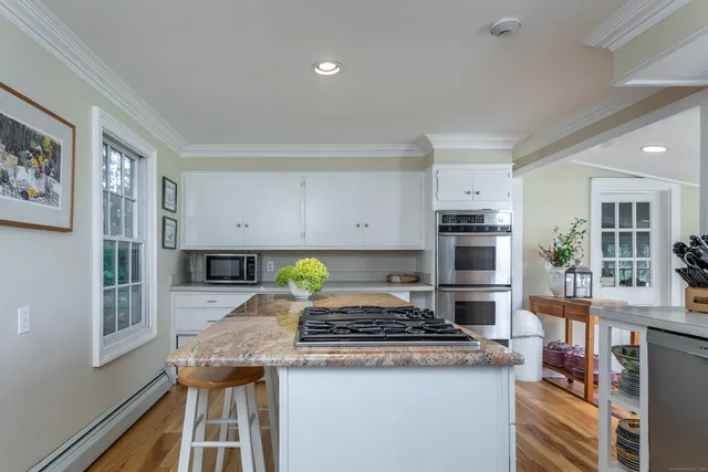a kitchen with a stove and a cabinets