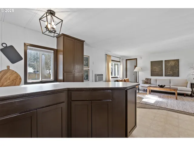 a open kitchen with a sink cabinets and appliances