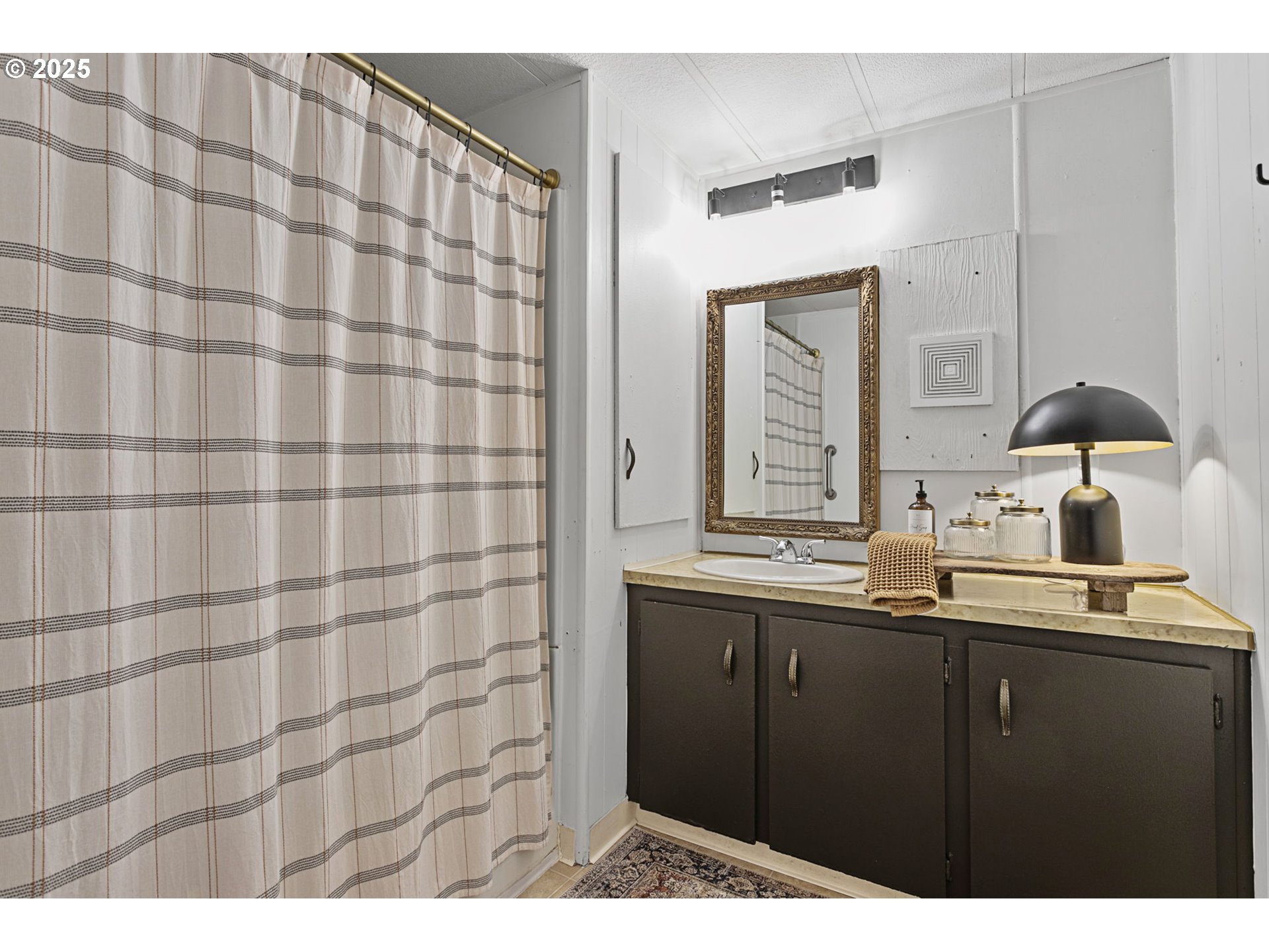 505 West Jones Street Yacolt, WA 98675 - Photo 16 of 26 a kitchen with a sink and a mirror