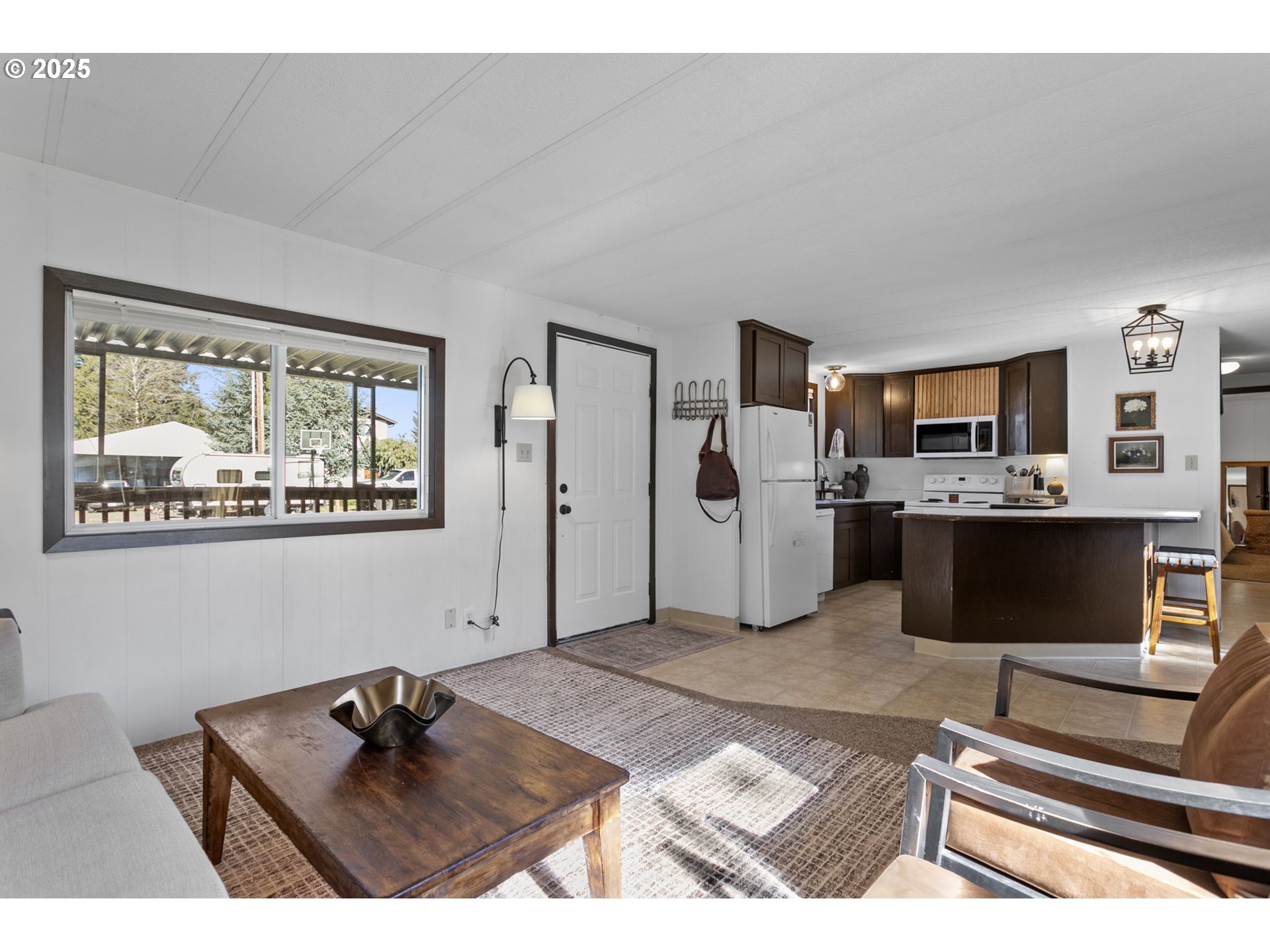 505 West Jones Street Yacolt, WA 98675 - Photo 4 of 26 a living room with furniture and painting on the wall