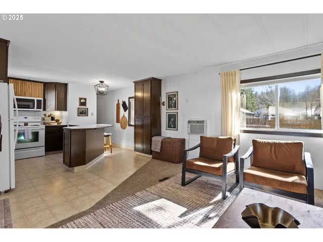 a living room with furniture and a area