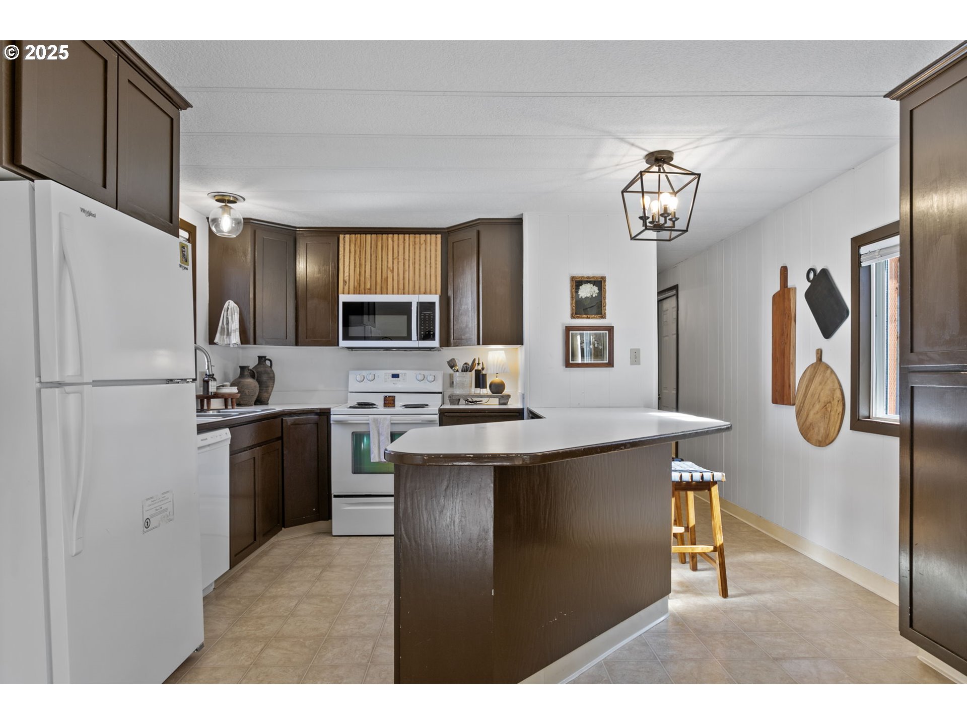 505 West Jones Street Yacolt, WA 98675 - Photo 8 of 26 a kitchen with a refrigerator a sink and dishwasher
