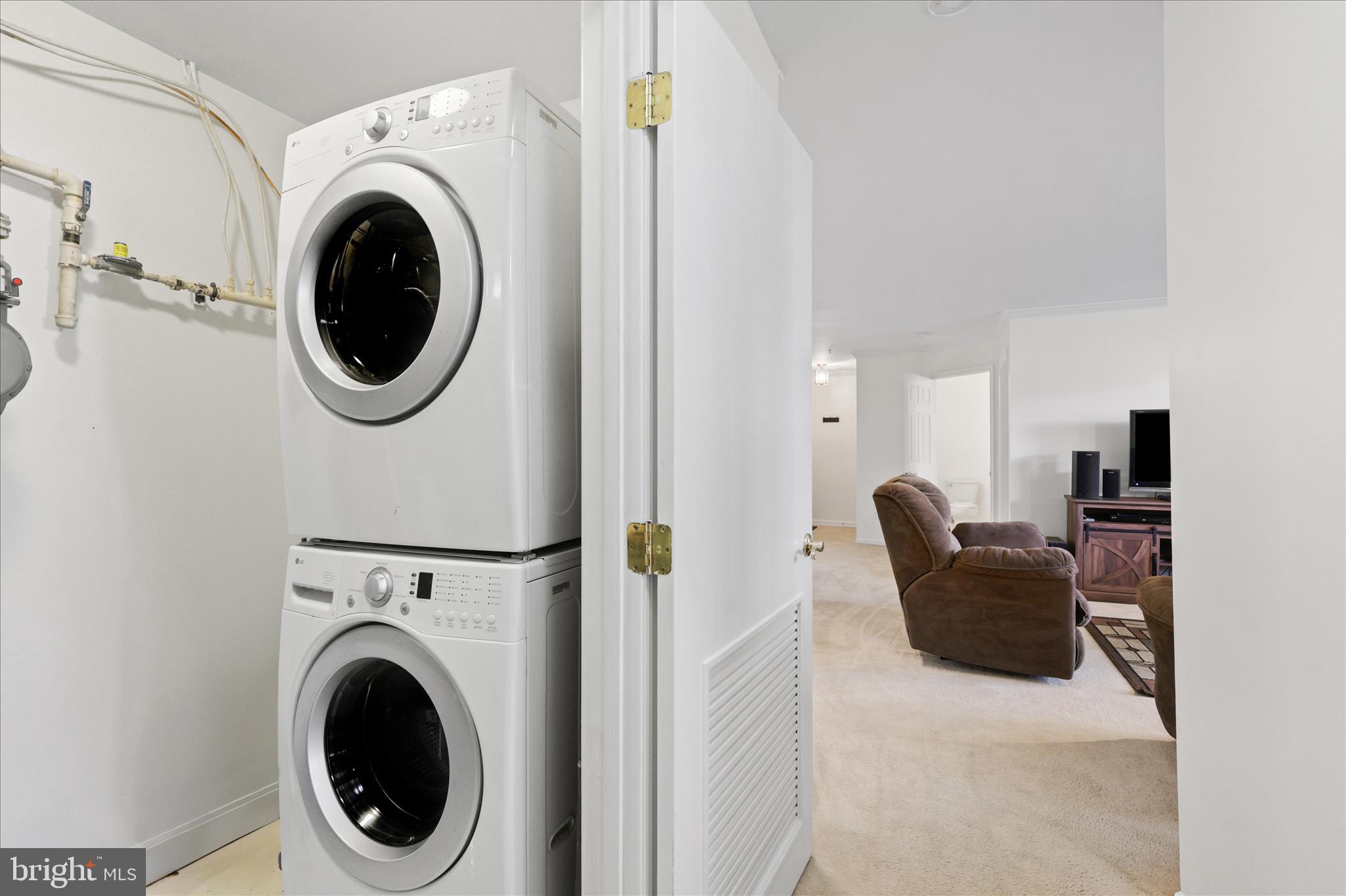 11002 Koman Circle, Unit 103 Manassas, VA 20109 - Photo 12 of 31 a view of a hallway with washer and dryer