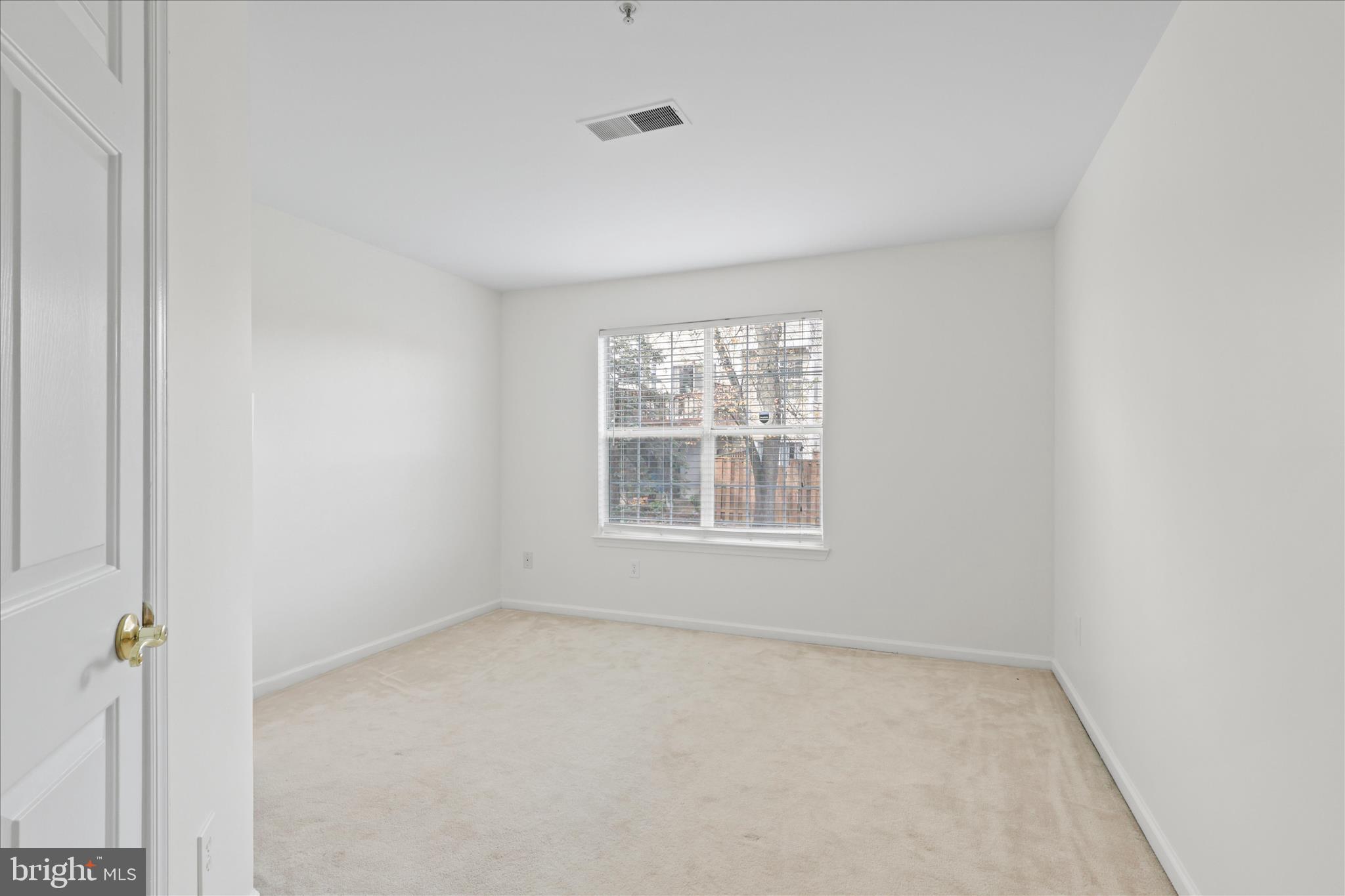 11002 Koman Circle, Unit 103 Manassas, VA 20109 - Photo 16 of 31 an empty room with a window