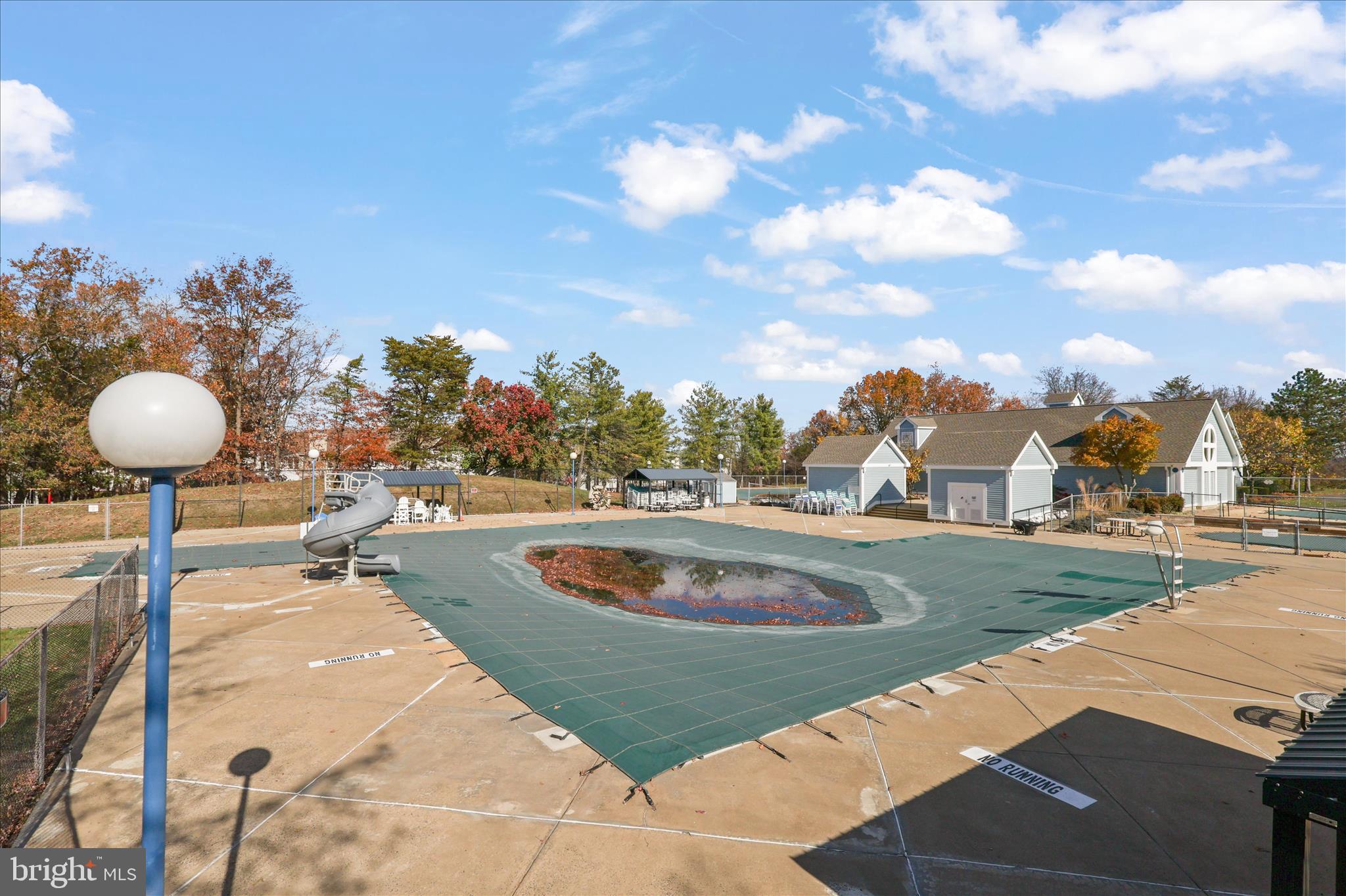 11002 Koman Circle, Unit 103 Manassas, VA 20109 - Photo 21 of 31 a view of a swimming pool with a yard and seating area
