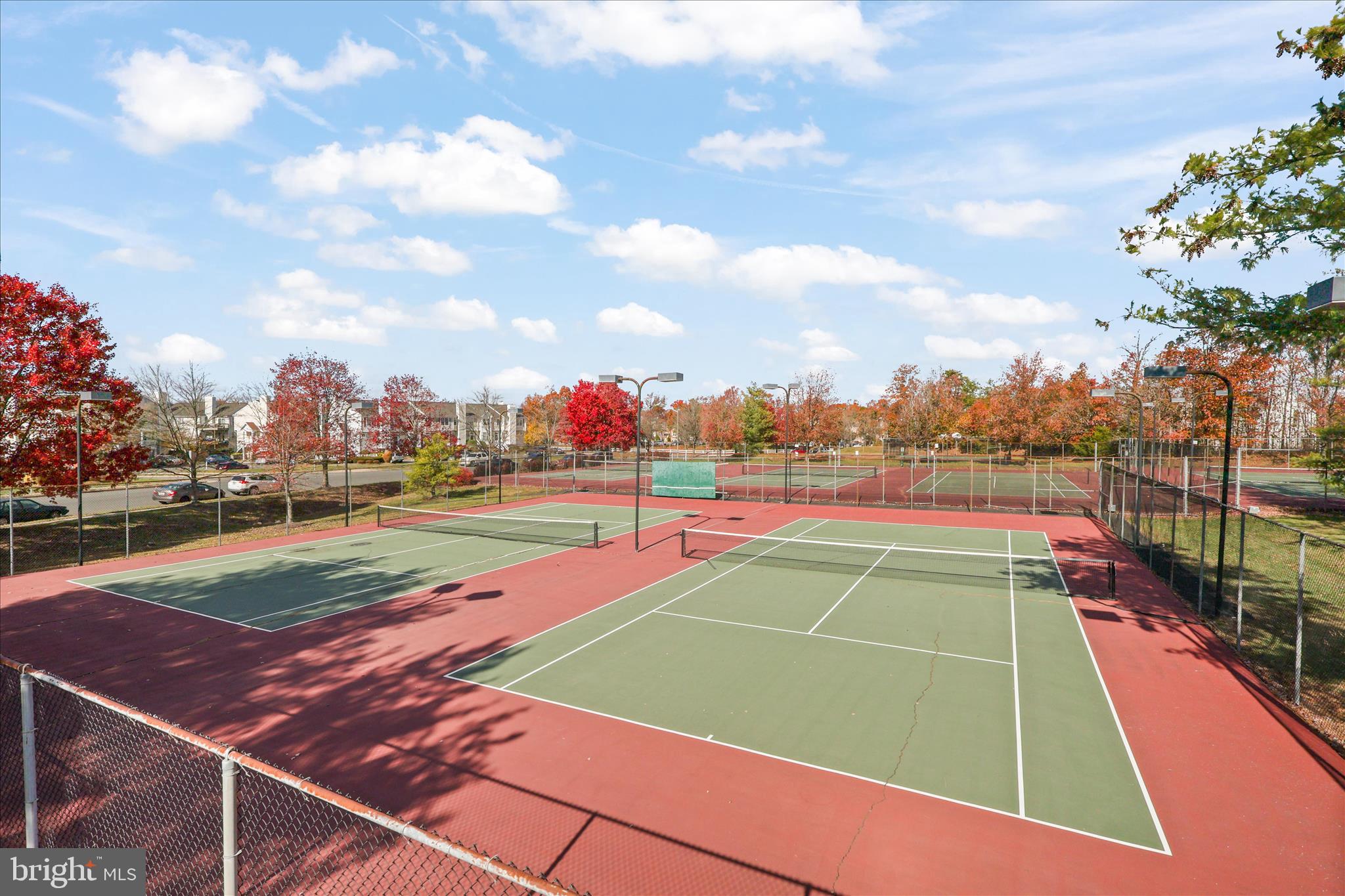 11002 Koman Circle, Unit 103 Manassas, VA 20109 - Photo 22 of 31 a tennis court that has tennis net