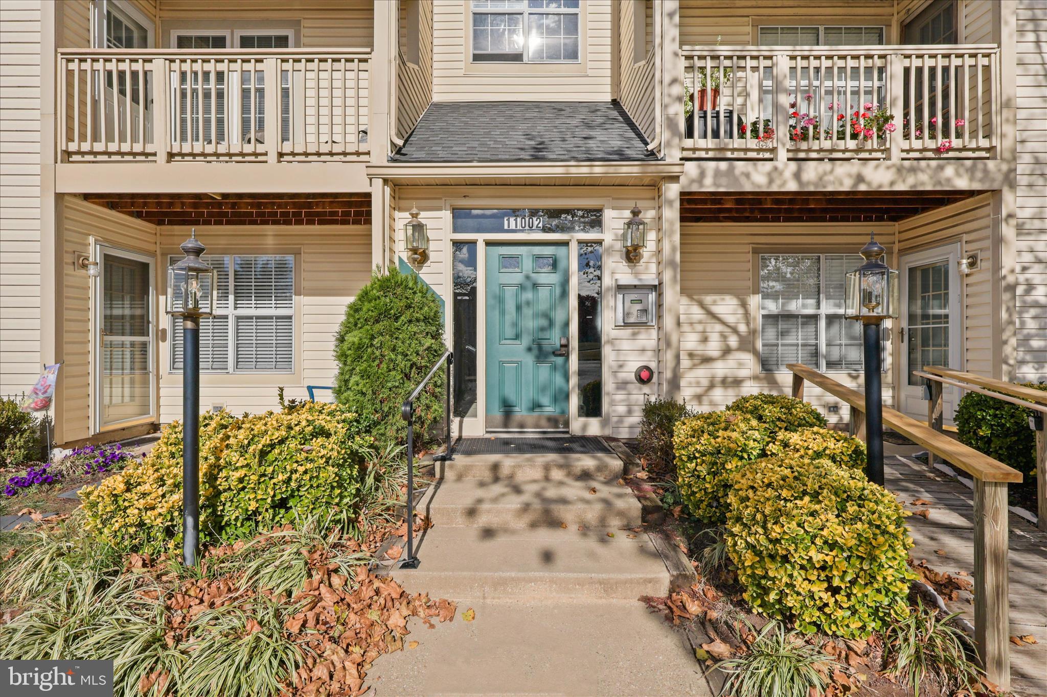 11002 Koman Circle, Unit 103 Manassas, VA 20109 - Photo 3 of 31 front view of a building