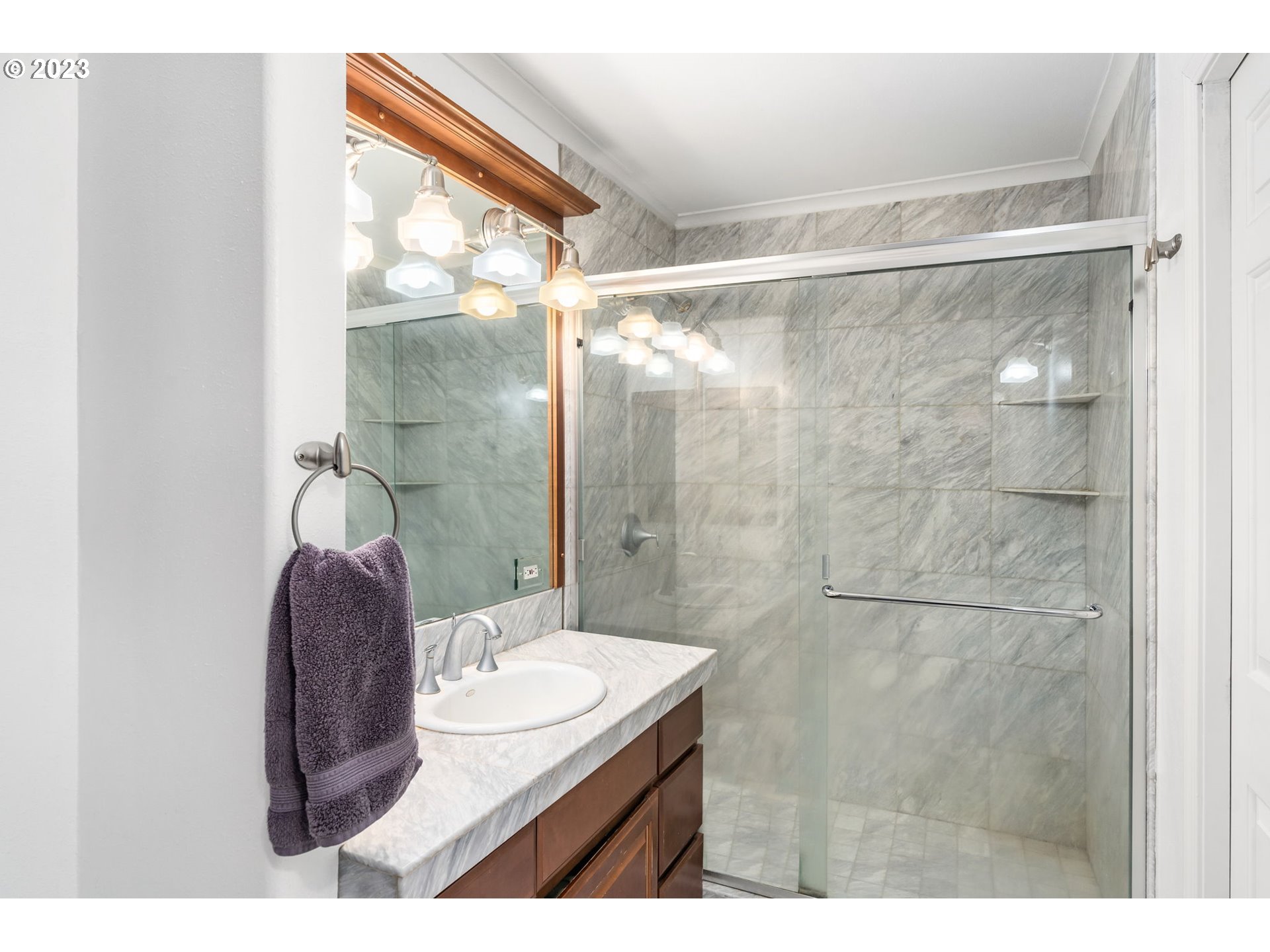 28268 Old Rainier Road Rainier, OR 97048 - Photo 13 of 28 a bathroom with a granite countertop shower sink and mirror