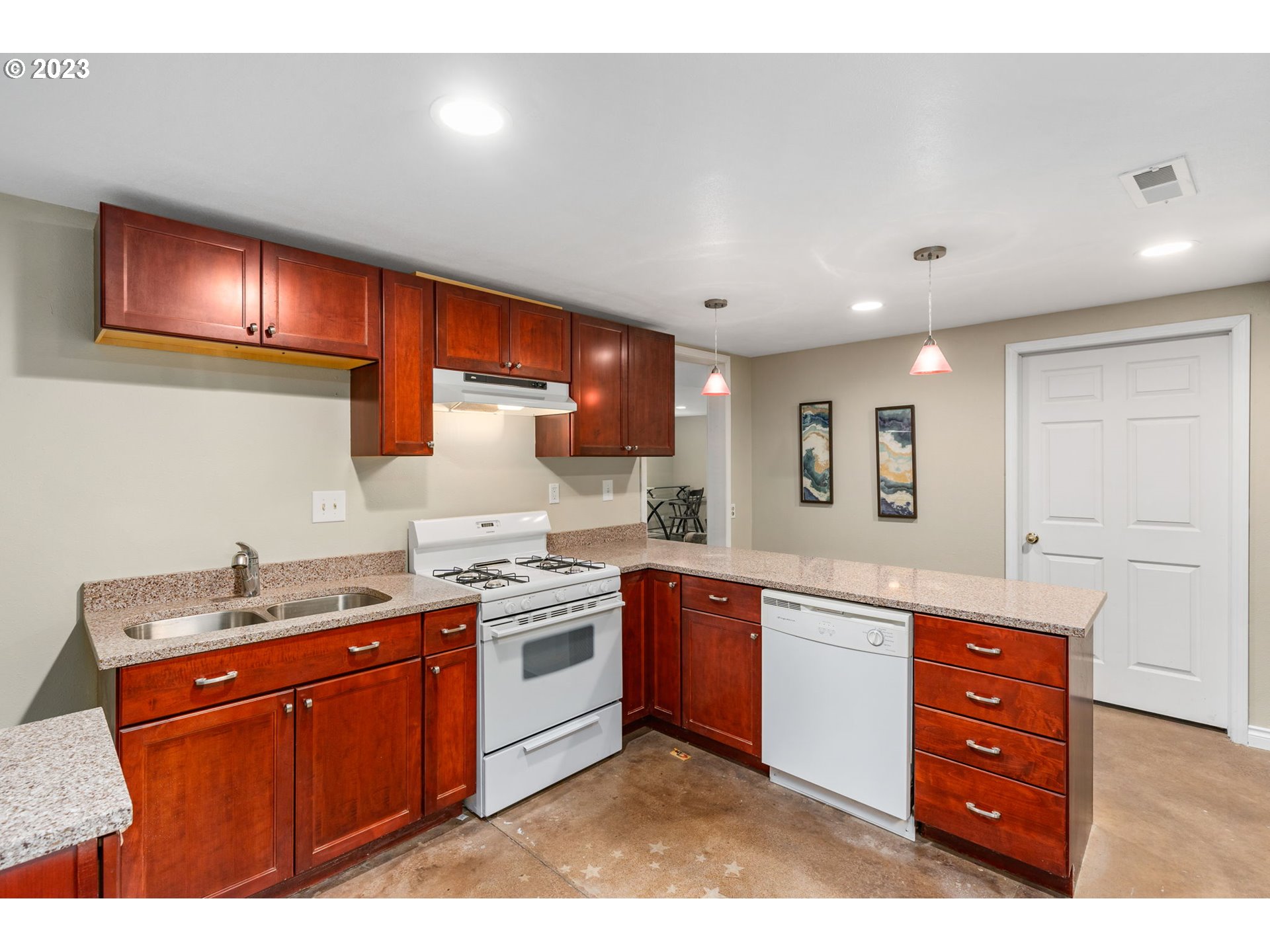 28268 Old Rainier Road Rainier, OR 97048 - Photo 18 of 28 a kitchen with stainless steel appliances granite countertop a sink stove and cabinets