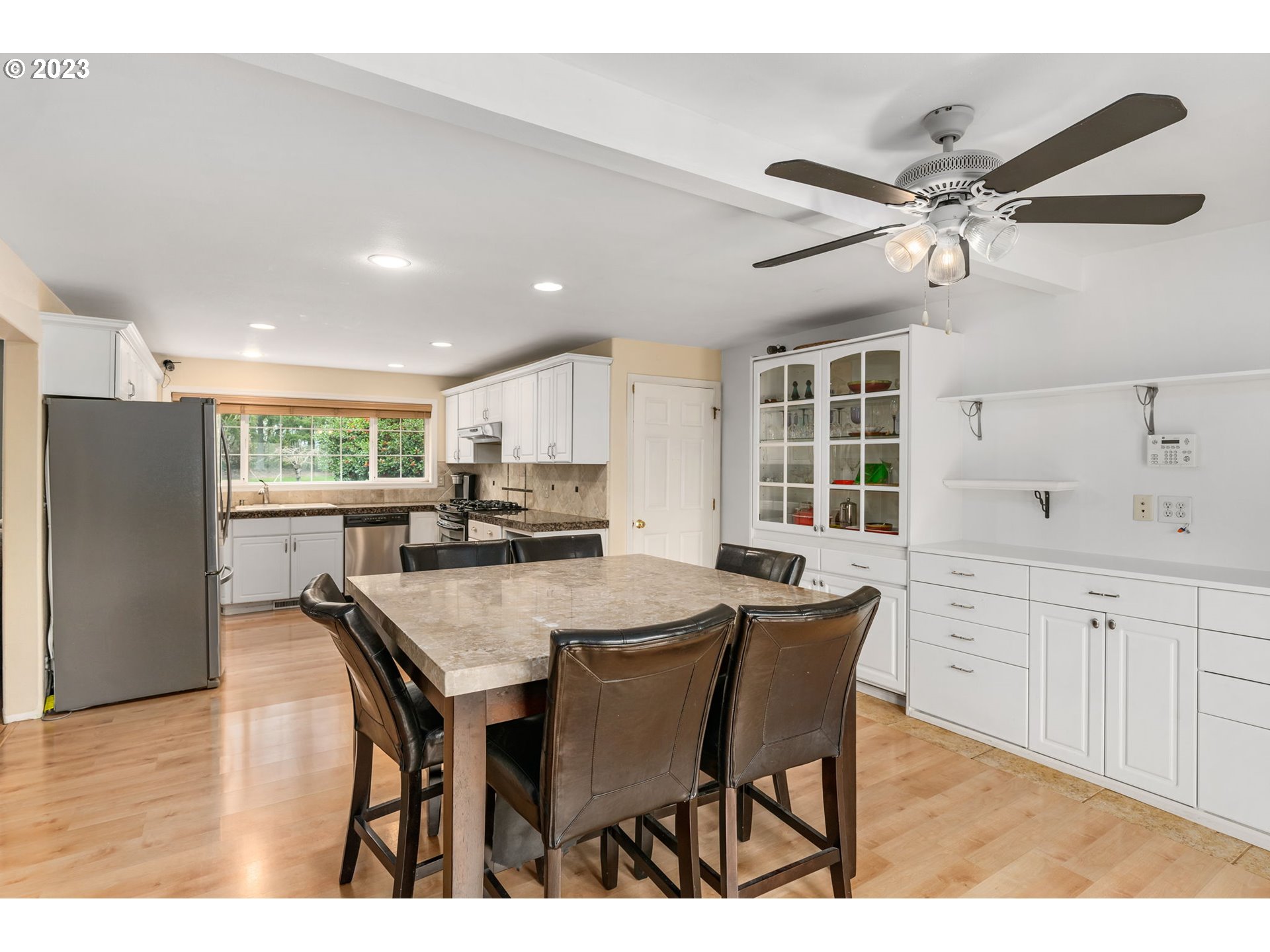 28268 Old Rainier Road Rainier, OR 97048 - Photo 4 of 28 a kitchen with kitchen island a dining table and chairs
