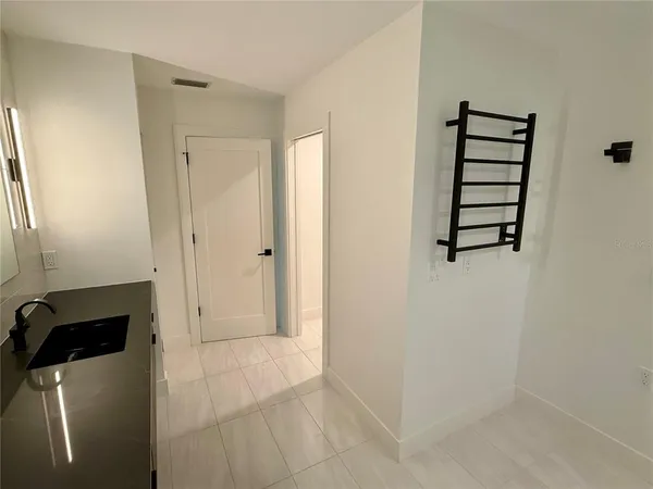 en empty room with windows and entrance