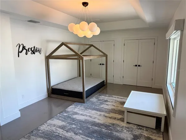 a view of an empty room with a fireplace