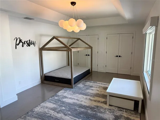 a view of an empty room with a fireplace