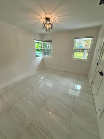 a view of a park with large trees