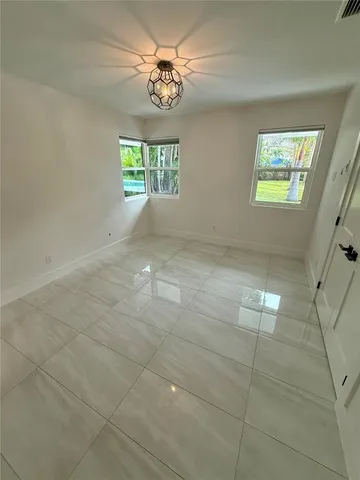 a view of a park with large trees