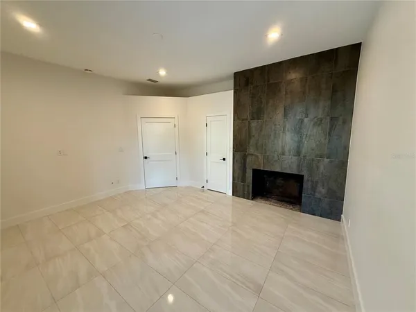 a view of a house with swimming pool and sitting area